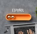 stylized loading bar with the word SPANISH in Spanish and office equipment on concrete background
